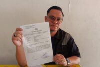 Pengacara menunjukkan surat laporan. Foto: JP